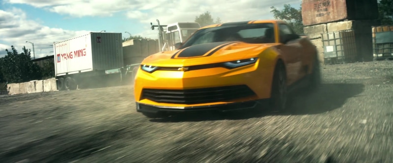 on the move, building exterior, Transformers, transportation, school bus, yellow, day, chevrolet, built structure, road, motion, speed, street, camaro