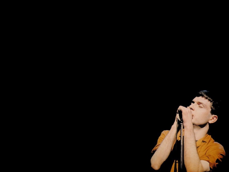 adult, stage, holding, men, studio shot, standing, one person, unknown pleasures, 480P, performance, black background, front view, looking away, three quarter length