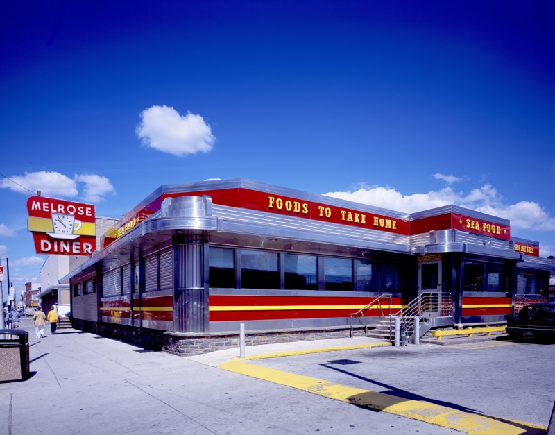 western script, outdoors, art deco, chrome, building exterior, Foods, melrose diner, blue, sign, building, Home building, transportation, no people, communication