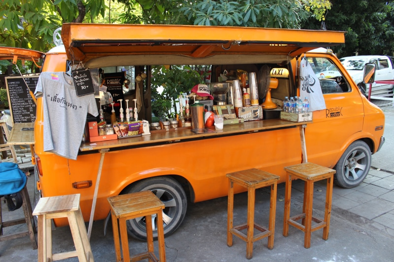 motor vehicle, transportation, public transportation, day, street, bar, chair, truck, outdoors, vehicle, automobile, land Vehicle, food van, stools, editorial