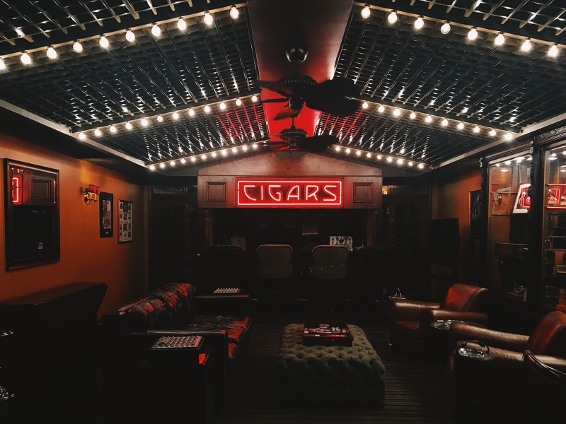 middle, bar - drink establishment, interior, ceiling fan, indoors, lounge, signage, built structure, bar, ceiling, technology, lights, sign, brown, neon lighs