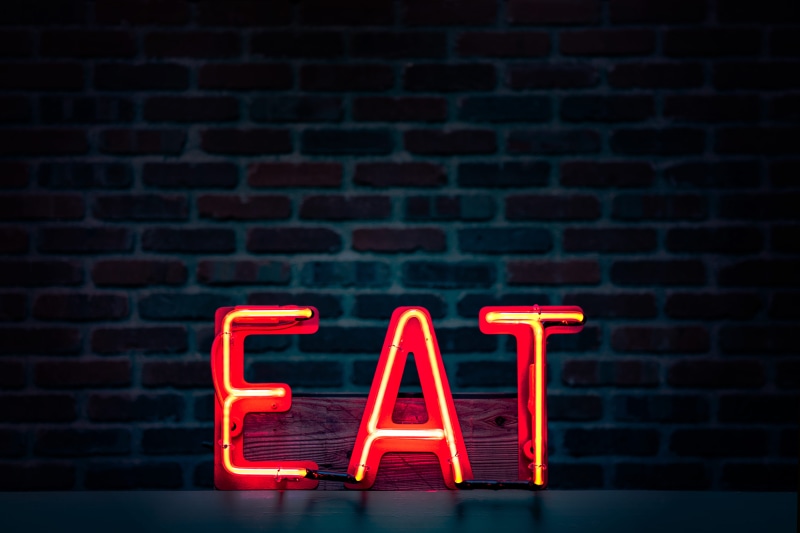 design, communication, text, indoors, lighting equipment, turned, wall, red, 8K, brick wall, western script, light, dark, architecture, no people, alphabet