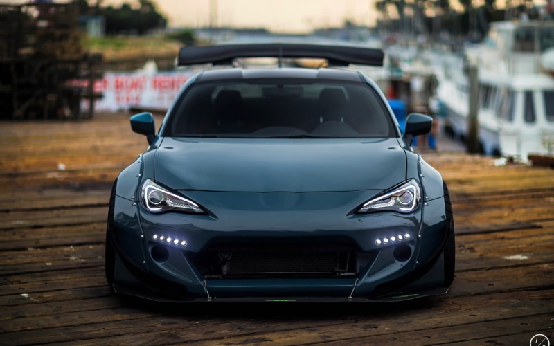 street, vintage car, subaru toyota gt86 scion fr s subaru brz, land vehicle, mode of transportation, indoors, focus on foreground, 1080P, close-up, reflection