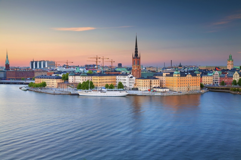sky, Riddarfjarden Bay, building, travel, place of worship, sunset, outdoors, Gamla Stan, promenade, built structure, Riddarholmen, Stockholm, cityscape