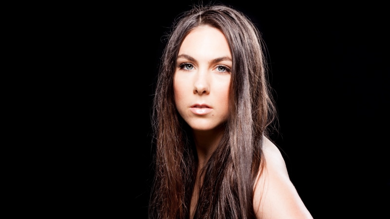 headshot, human hair, 5K, teenager, contemplation, metalheads, beauty, adolescence, black background, singer, Swedish, one person, human body part, celebrity