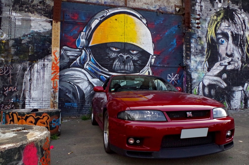 720P, red, creativity, car, human representation, mode of transportation, architecture, street art, graffiti, city, art and craft, motor vehicle, Nissan Skyline GT-R R33