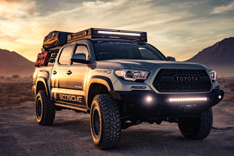 truck, road, headlight, design, transportation, dessert, black, car, sky, tyres, transportation system, trademark, branding, nature, mode of transportation