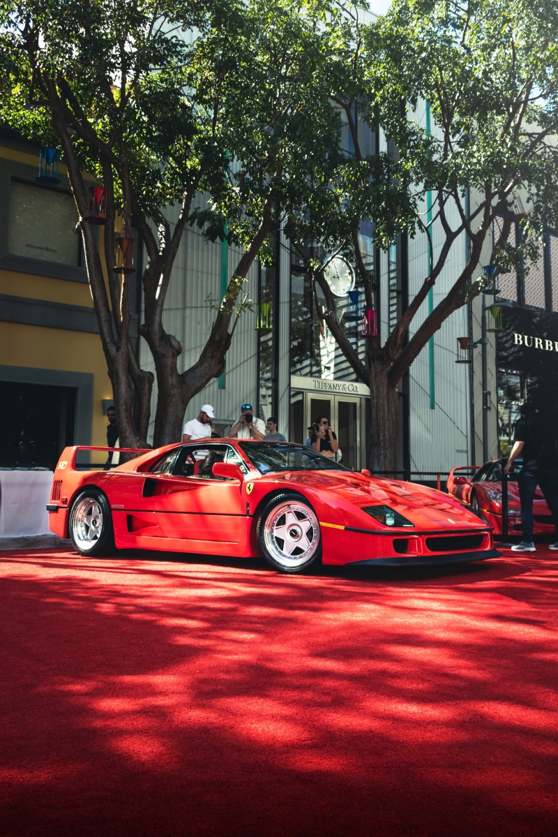 sportscar, automobile, day, building exterior, exoticcar, architecture, 4K, outdoors, carphotography, wheel, alloy wheel, sign, built structure, no people