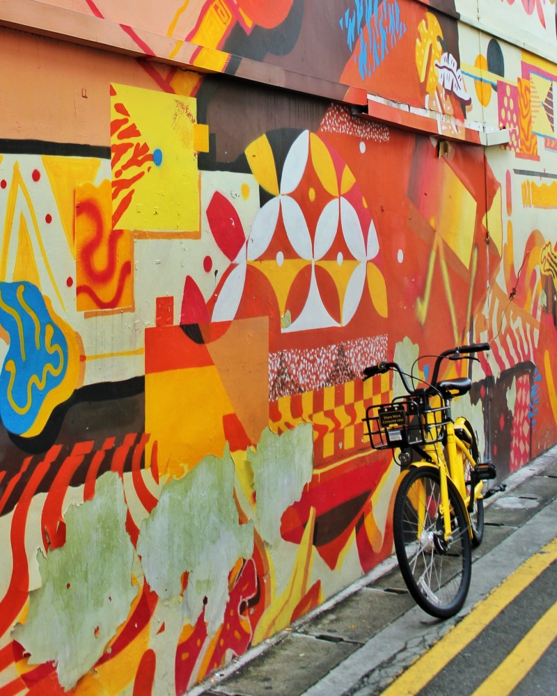 multi colored, mode of transportation, art and craft, painting, wall - building feature, bmx, wall, black, city, built structure, no people, wheel, land vehicle