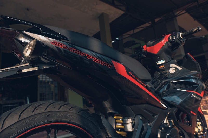 engine, machinery, garage, day, wheel, exciter, tire, vehicle, stationary, machine, underbone, no people, car, high angle view, motor, motorbike, transportation