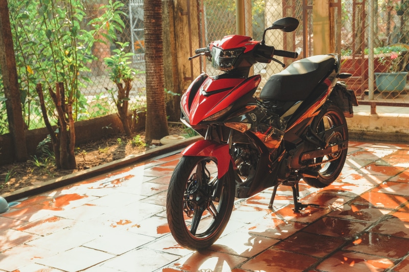 vehicle, men, outdoors, headwear, moped, underbone, stand, crash helmet, mode of transportation, full length, brown, one person, motorbike, transportation