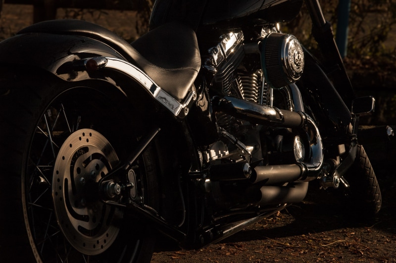 2K, focus on foreground, bush, bike, technology, vehicle, near, dark, motor, parked, gray, engine, motorbike, mode of transportation, no people, cruiser