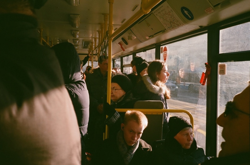 vehicle, group of people, person, sitting, trolley, mode of transportation, real people, inside, window, journey, food court, vessel, ferry, outdoors, double decker bus