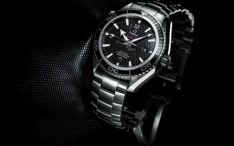 black color, watch, time, number, black background, single object, metal, technology, wristwatch, indoors, studio shot, no people, close-up, silver colored