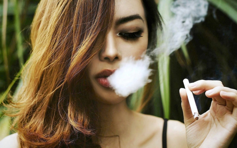 young women, 720P, focus on foreground, women, teenager, portrait, activity, hairstyle, one person, closed eyes, looking at camera, hair, smoking - activity