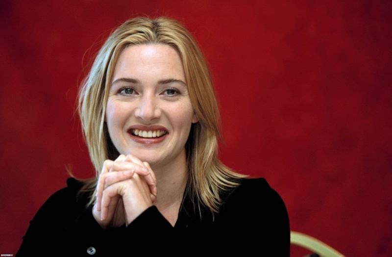 studio shot, blond hair, front view, Kate Winslet, portrait, indoors, emotion, positive emotion, beautiful woman, hair, human face, happiness, colored background