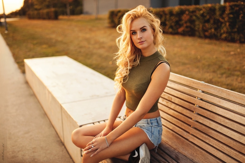 hairstyle, women, blonde, jean shorts, leisure activity, outdoors, portrait, mini dress, depth of field, one person, sitting, bench, young women, blond hair