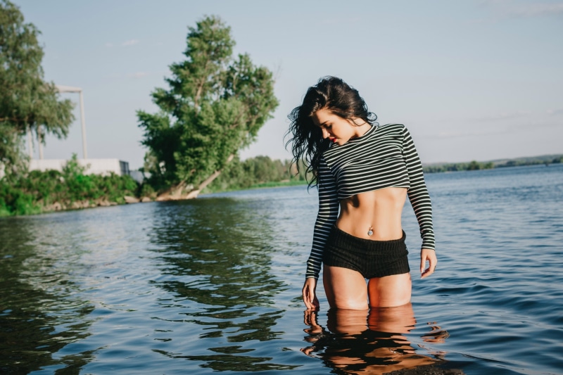 sky, outdoors, piercing, hairstyle, water, brunette, waterfront, plant, day, standing, leisure activity, portrait, white, lake, tree, childhood, the gap