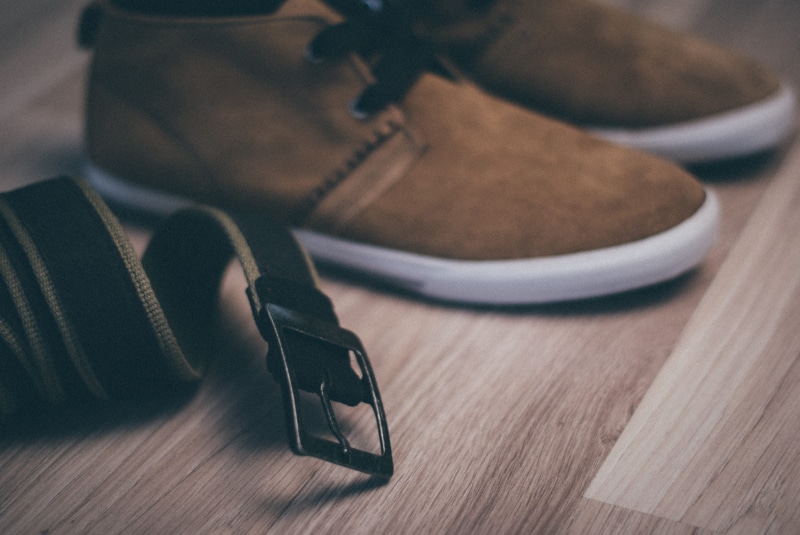 belt, arts culture and entertainment, clothing, human body part, personal accessory, shoe, women, one person, indoors, technology, clothes, adult, lifestyles