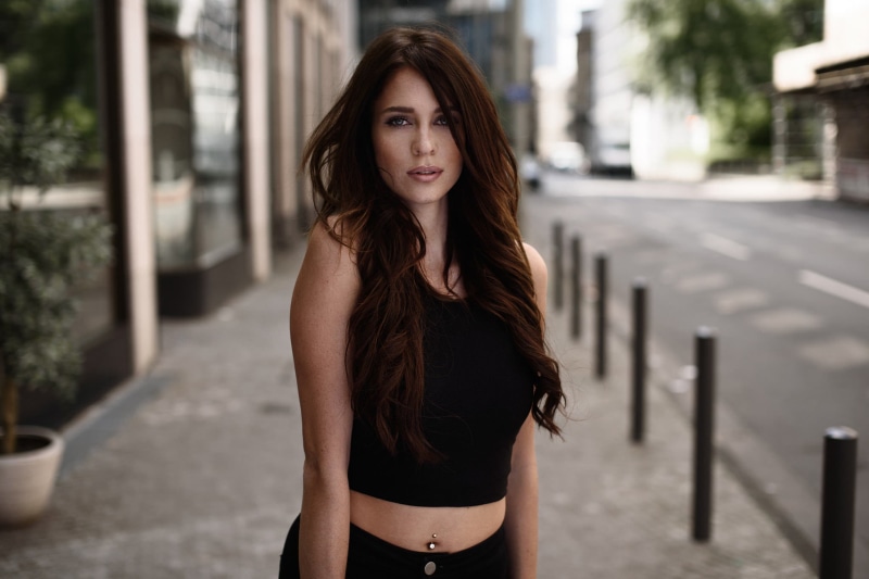 beauty, real people, outdoors, standing, front view, 1080P, leisure activity, brown hair, portrait, pierced navel, women, young adult, one person, long hair