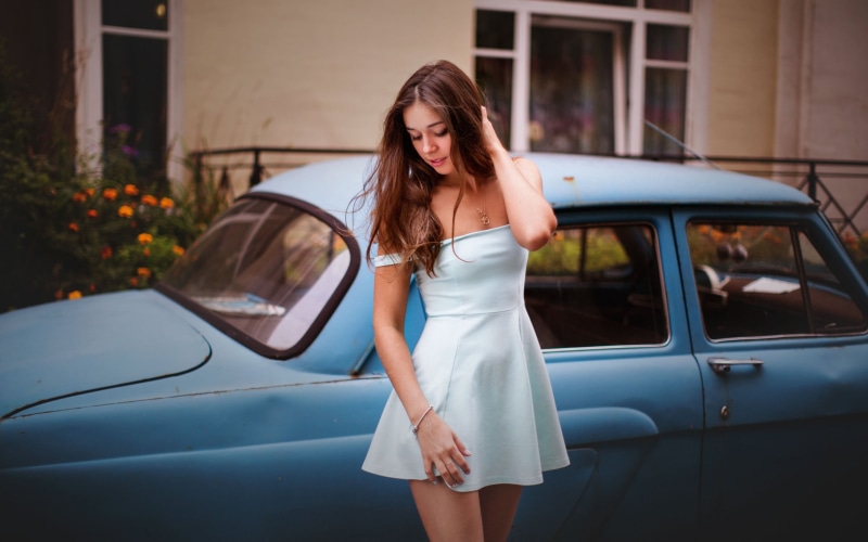 beauty, one person, lifestyles, colored, long hair, minidress, white dress, day, dress, real people, beautiful woman, young adult, land vehicle, transportation
