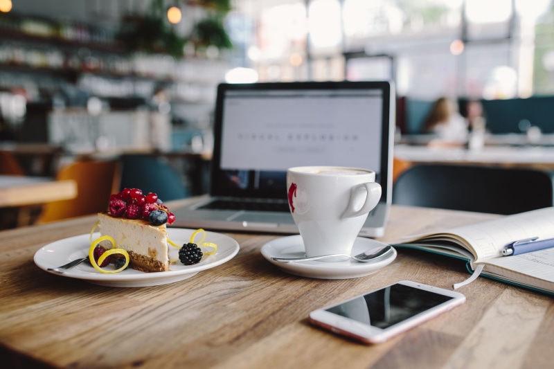 macbook, wireless technology, business, wooden table, work, cheese, table, crockery, connection, food and drink, food, wooden desk, plate, fruits, indoors