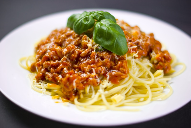serving size, close-up, spaghetti, no people, leaf, plant part, savory sauce, herb, healthy eating, garnish, 4K, freshness, temptation, plate, wellbeing