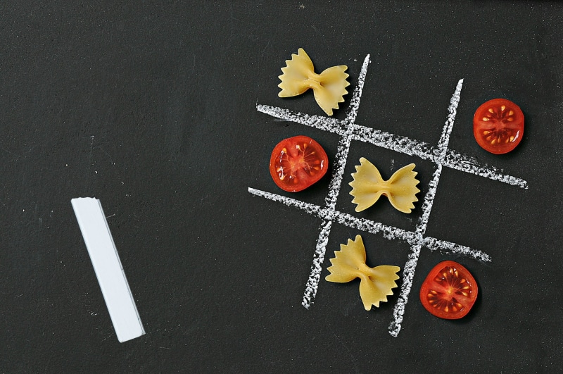 chalk, indoors, directly above, choice, medium group of objects, preparation, tomatoes, still life, creativity, black background, high angle view, shape
