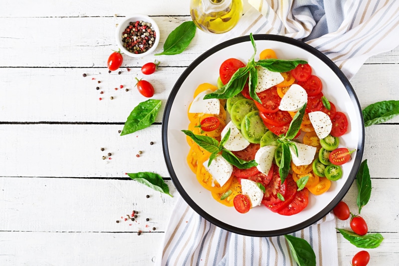 tomatoes, Black pepper (Spice), wooden surface, salad, basil, 2K, Mozzarella, plates, olive oil, food