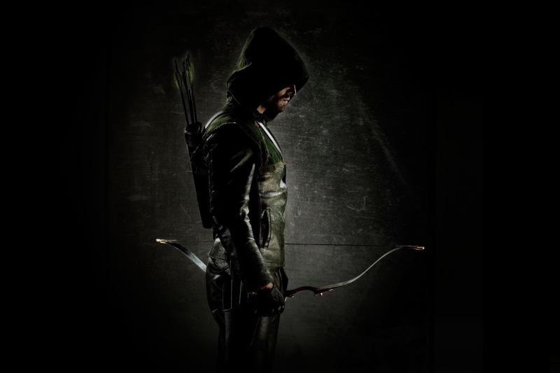 indoors, evil, side view, Oliver Queen, thief, standing, holding, black Background, crime, criminal, males, shadow, green, clothing, full length, night