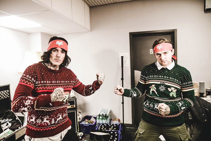 warm clothing, real people, lifestyles, young men, indoors, front view, portrait, two people, people, Bring Me The Horizon, clothing, young adult, crazy