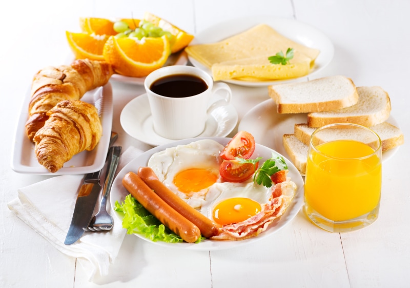 egg yolk, vegetable, fried Egg, no People, table knife, lemon, toast, yellow, drinking Glass, cooked, teacup, dinner, crockery, continental Breakfast, snack