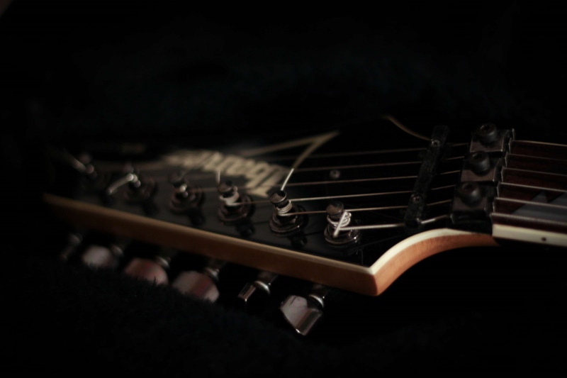 no people, selective focus, arts culture and entertainment, black background, medium group of objects, musical equipment, close-up, group of objects, indoors