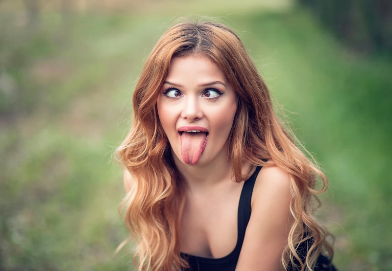 mouth open, young women, face, one person, tongues, women outdoors, brown hair, adult, women, teenager, headshot, focus on foreground, model, hair, brunette