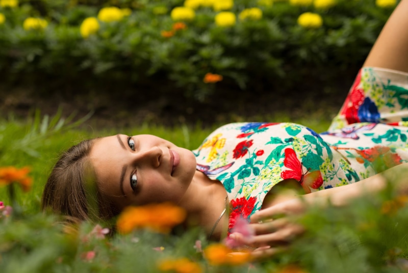 Anton Pechkurov, side view, field, beauty, clothing, lies, 1080P, flowers, summer, contemplation, smile, woman, young women, leisure activity, chain, headshot