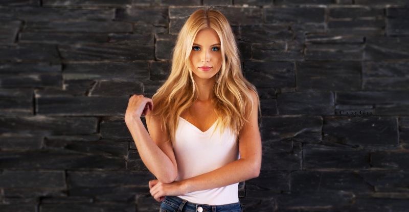 blond hair, lifestyles, bare shoulders, women, hair, hairstyle, blonde, adult, one person, casual clothing, architecture, looking at camera, beauty, front view
