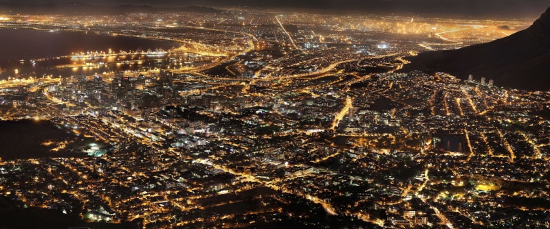 illuminated, architecture, built structure, brown, building, flying, air vehicle, travel destinations, environment, city life, aerial view, nature, area