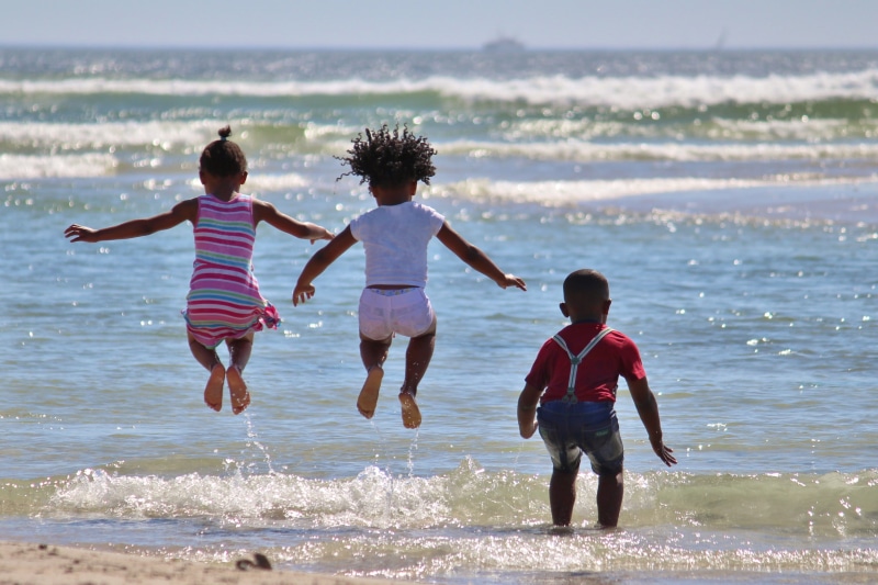 water, afro-american, hop, children, south africa, togetherness, fun, sea, sister, land, seashore, playing, child, jump, daytime, leisure activity, africa