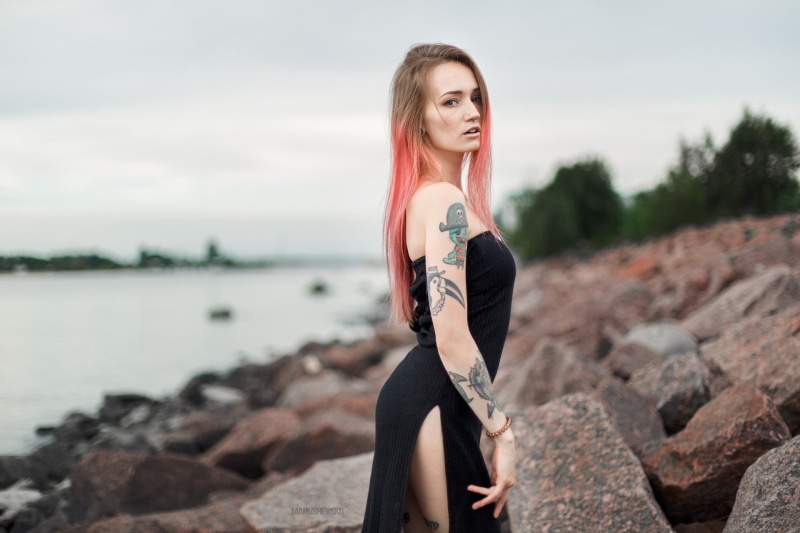 beautiful woman, nose rings, rock, 1080P, women, hair, pierced nose, real people, black dress, looking at viewer, nature, dress, sea, young women, rock - object