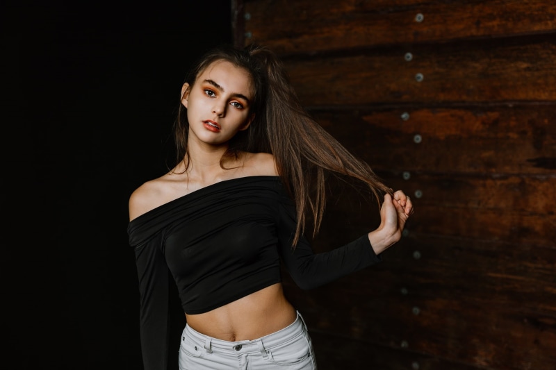 front view, beauty, black tops, hair, long hair, young adult, portrait, adult, women, young women, dark, fashion, brunette, touching hair, 1080P, three quarter length
