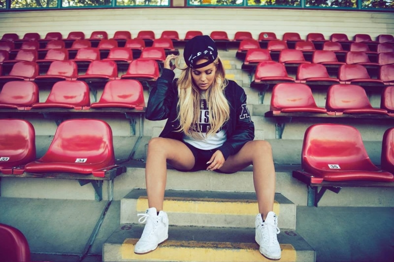 sportswear, fashion, blonde, sitting, women outdoors, young women, young adult, arts culture and entertainment, beautiful woman, real people, glasses, lifestyles