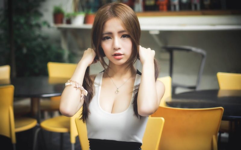 auburn hair, casual clothing, 2K, face, hairstyle, table, beautiful woman, young adult, dress, long hair, indoors, looking at camera, portrait, chair