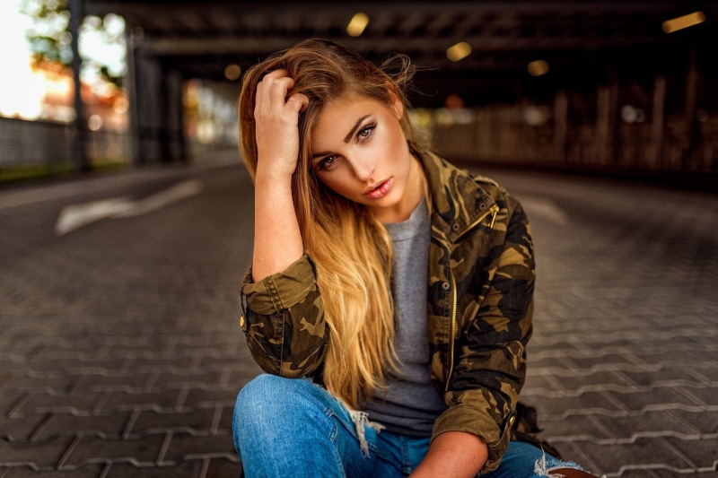 blonde, architecture, sitting, pants, beautiful people, street, depression - sadness, front view, young women, Miro Hofmann, emotion, hands on head, portrait