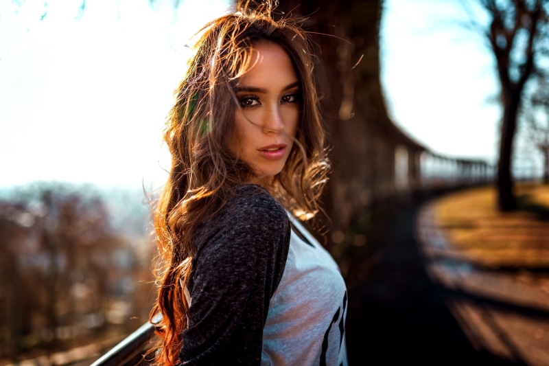 hairstyle, beautiful woman, long hair, wavy hair, young adult, leisure activity, Miro Hofmann, depth of field, women, contemplation, portrait, face, focus on foreground