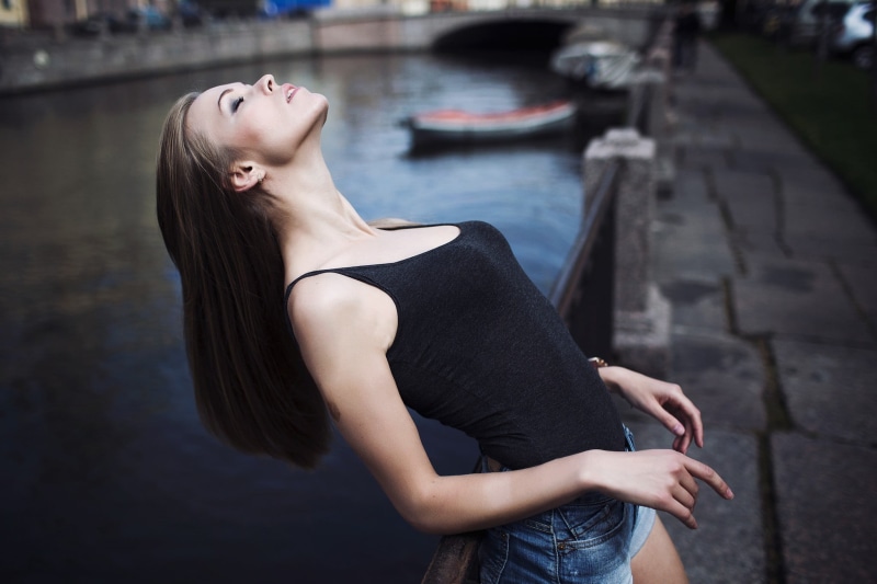 closed eyes, young adult, dress, jean shorts, young women, fashion, standing, arched back, beauty, looking, women, tank top, necks, water, beautiful woman