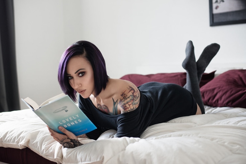 black stockings, dress, bedroom, legs up, women, hairstyle, lying down, indoors, domestic room, relaxation, one person, bed, home interior, young women