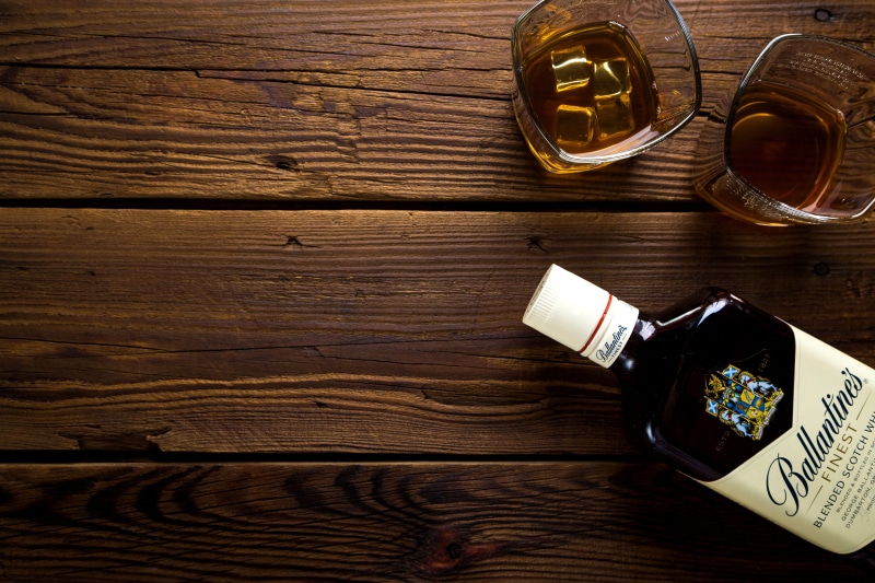 alcohol, indoors, coffee cup, wood grain, food, drinking, strong alcohol, bar, date, filled, still life, ballantine, liquid, container, surface, cup, european