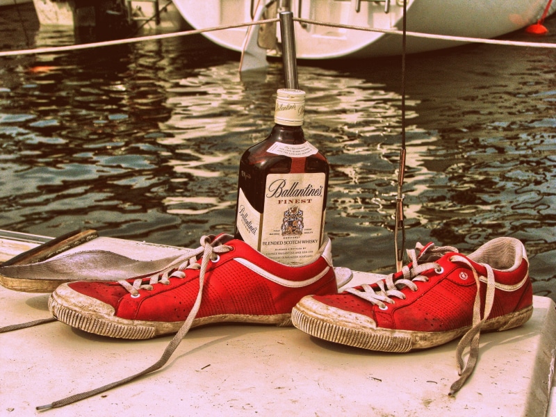sneakers, day, transportation, sea, western script, retro, mode of transportation, bottle, rope, nautical vessel, text, yacht, no people, alcohol, communication