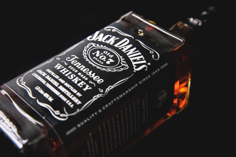 american, alcoholic, studio shot, no people, number, selective focus, technology, western script, indoors, bottle, close-up, communication, whisky, camera - photographic equipment