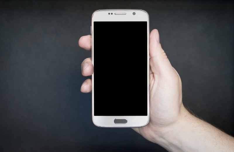 human hand, man, dark background, touch screen, screen, telephone, copyspace, internet, using phone, mobile phone, person, technology, black color, contact